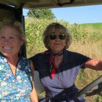 Two women in gold cart